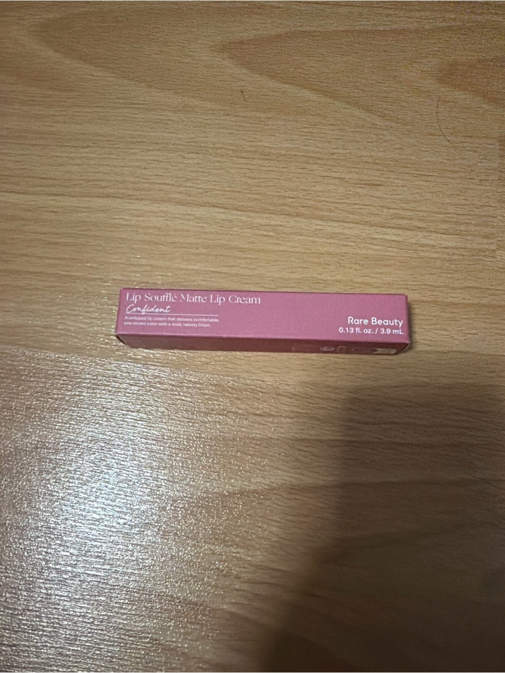 Lip product on wooden surface